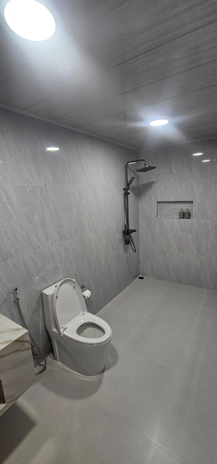 Private bathroom with rain shower at Ale Sara Guest House on Thoddoo, Maldives
