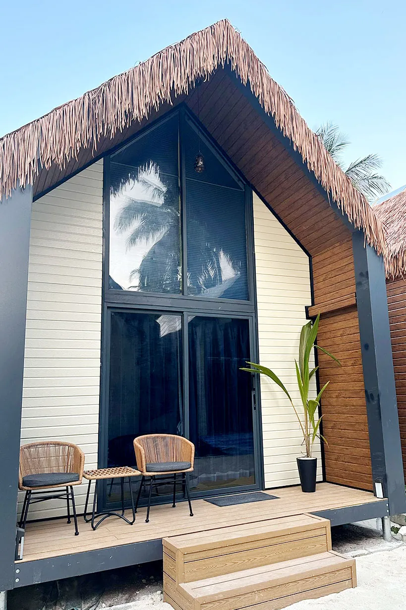 Thatched-roof villa with a private terrace at Ambra Maldives on Thoddoo