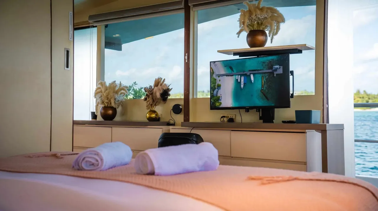 Cabin with a king size bed on the Atoll Villa yacht