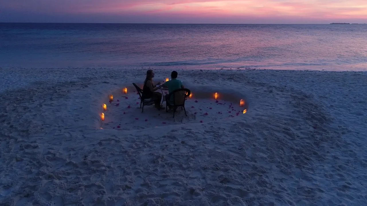 Sunset dinner on a sandbank arranged from the Atoll Villa yacht