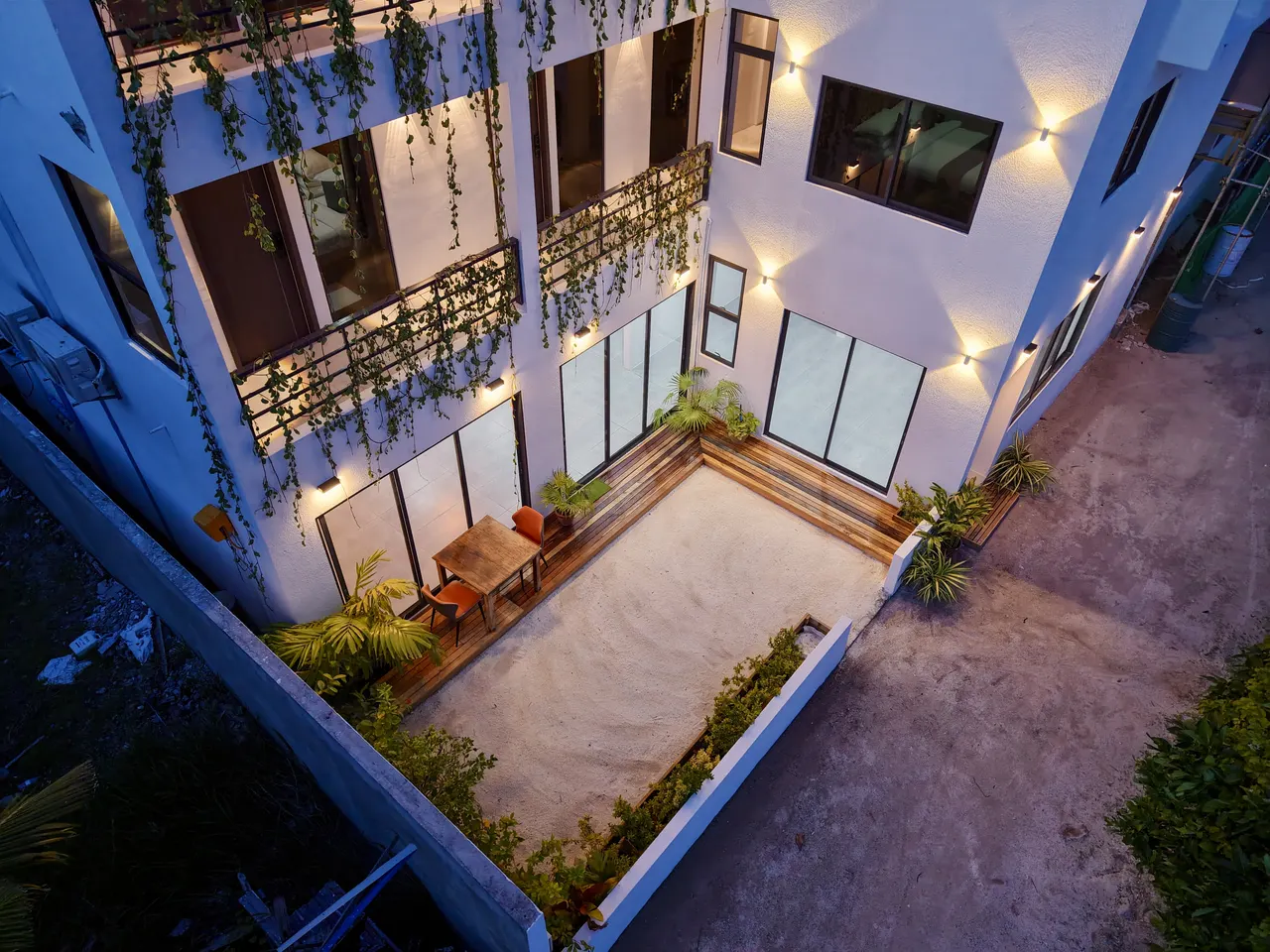 Cozy Art Dhangethi and its courtyard at dusk, seen from above