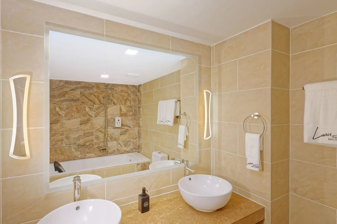 Family room bathroom with bathtub at Luau Beach Inn