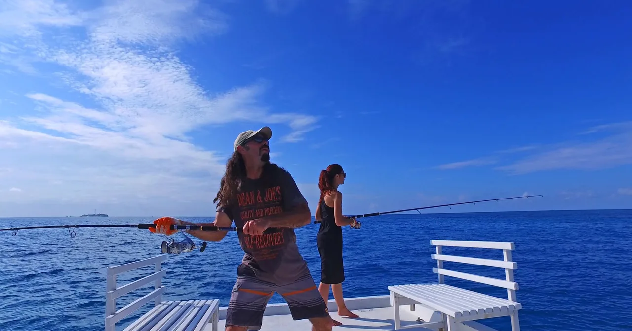 Guests fishing from a boat off Fulidhoo, Maldives