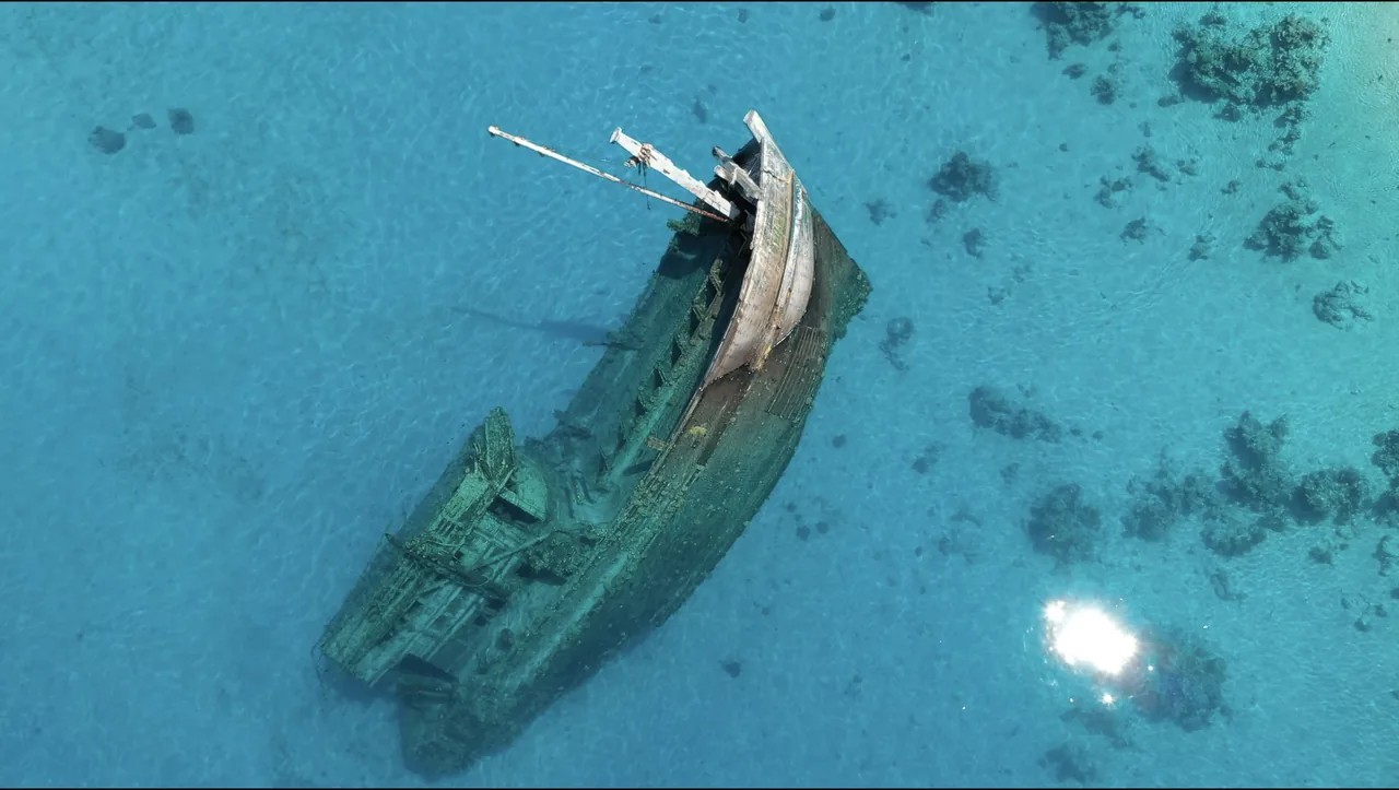 Aerial view of a shipwreck in the shallow water near Fulidhoo