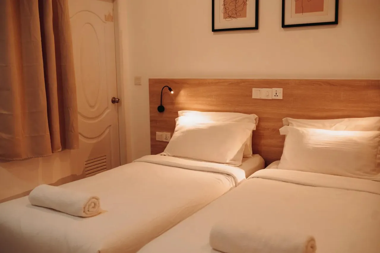Twin room with two beds at Nala Island Village, Maafushi
