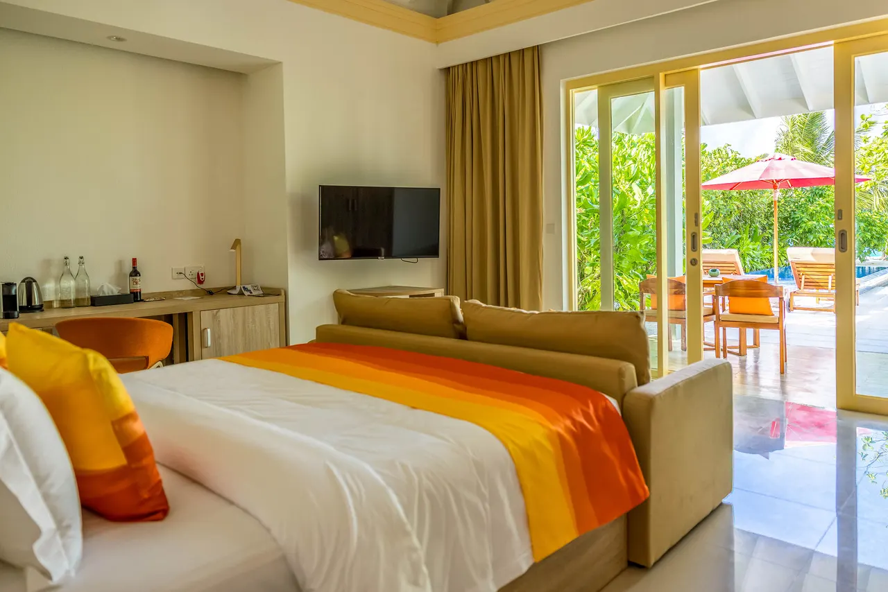 Pool beach villa bedroom at Siyam World, Maldives