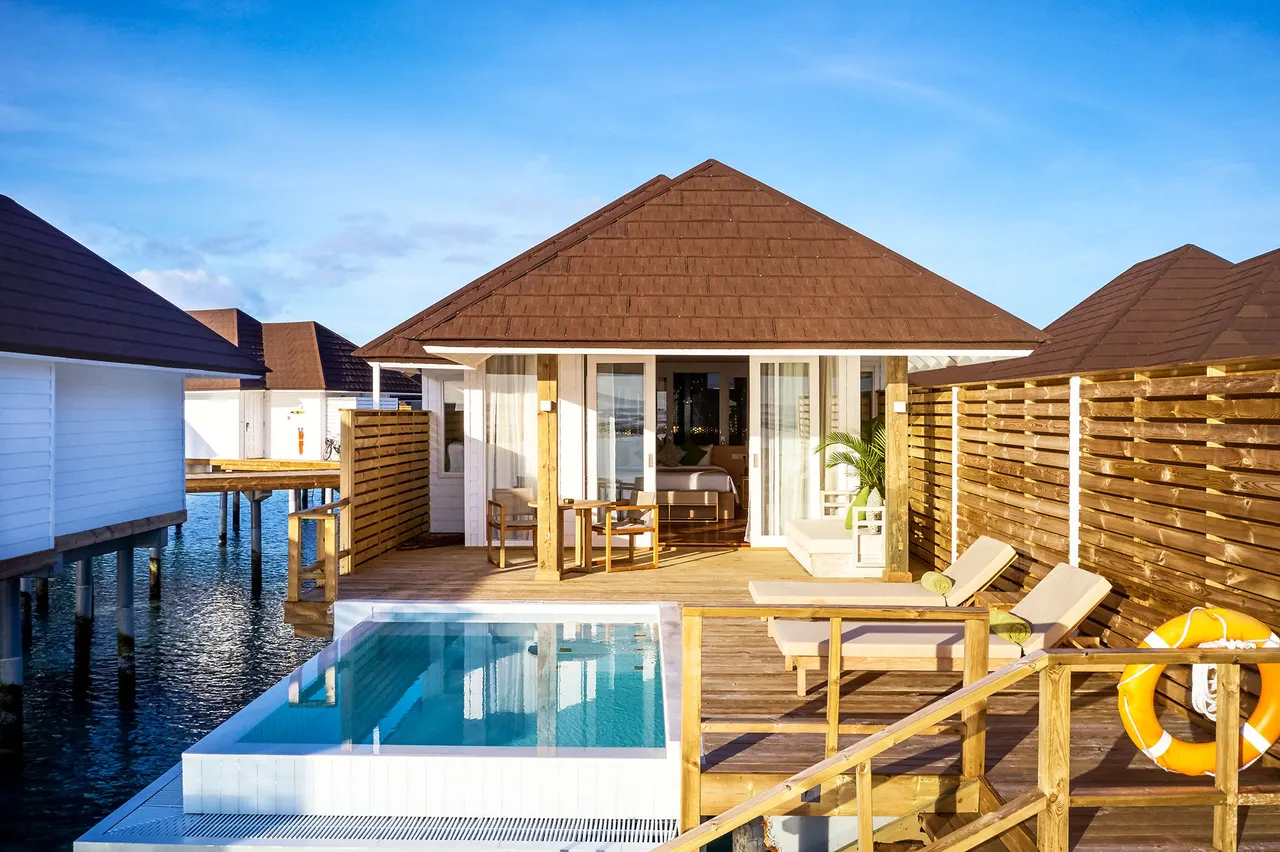 Water villas aerial at Romance Island, the adults-only island of Sun Siyam Olhuveli, Maldives