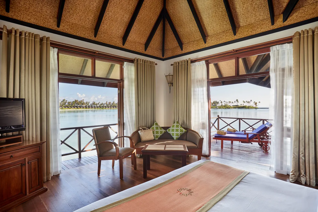Water villa bedroom at Sun Siyam Olhuveli, Maldives