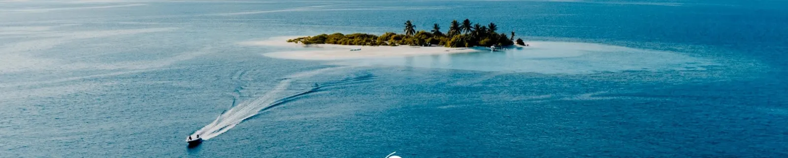 Scubaspa speedboat heading to a deserted island