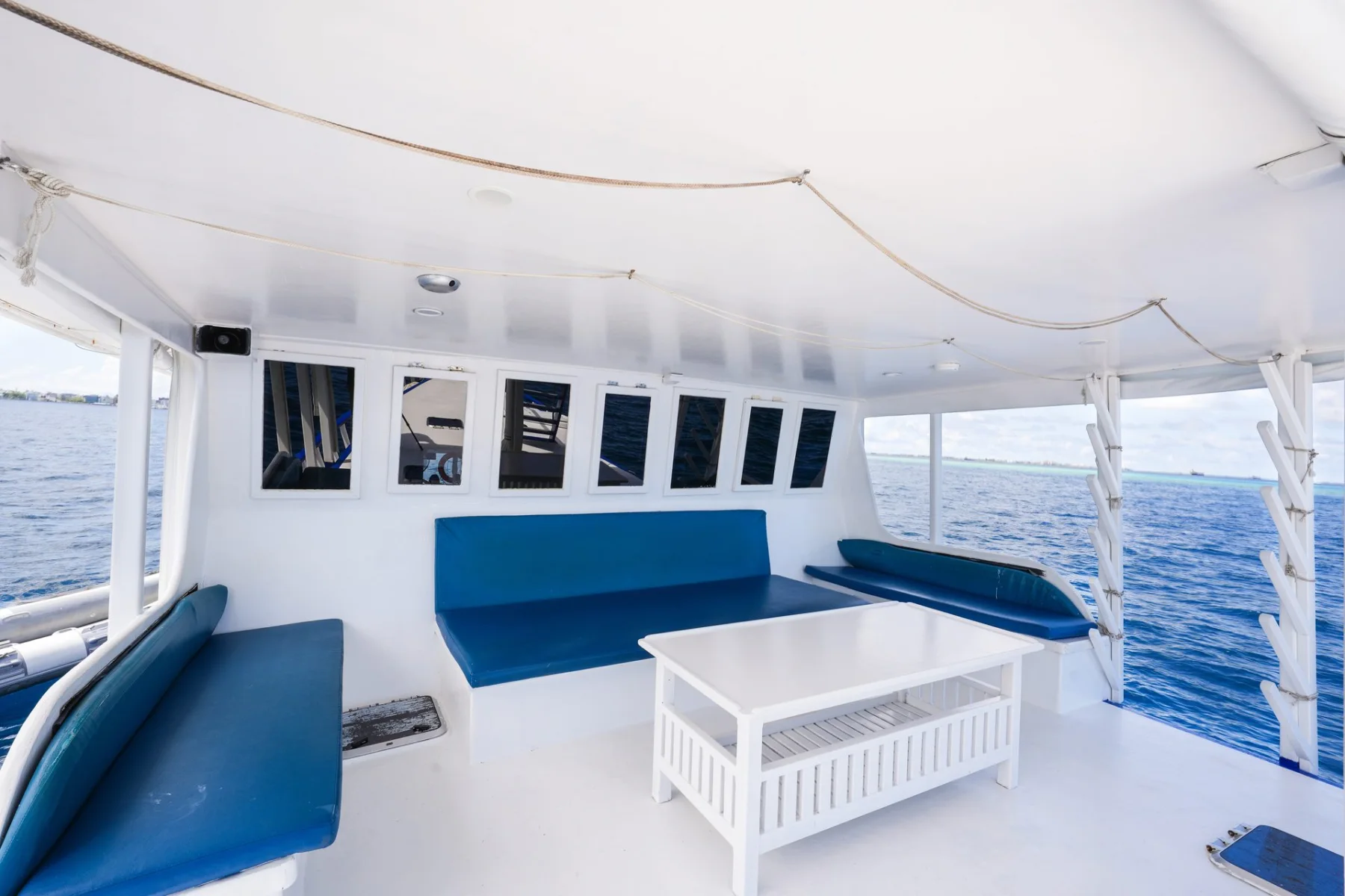 Shaded deck lounge aboard Gulfaam for relaxing after a day surfing or cruising