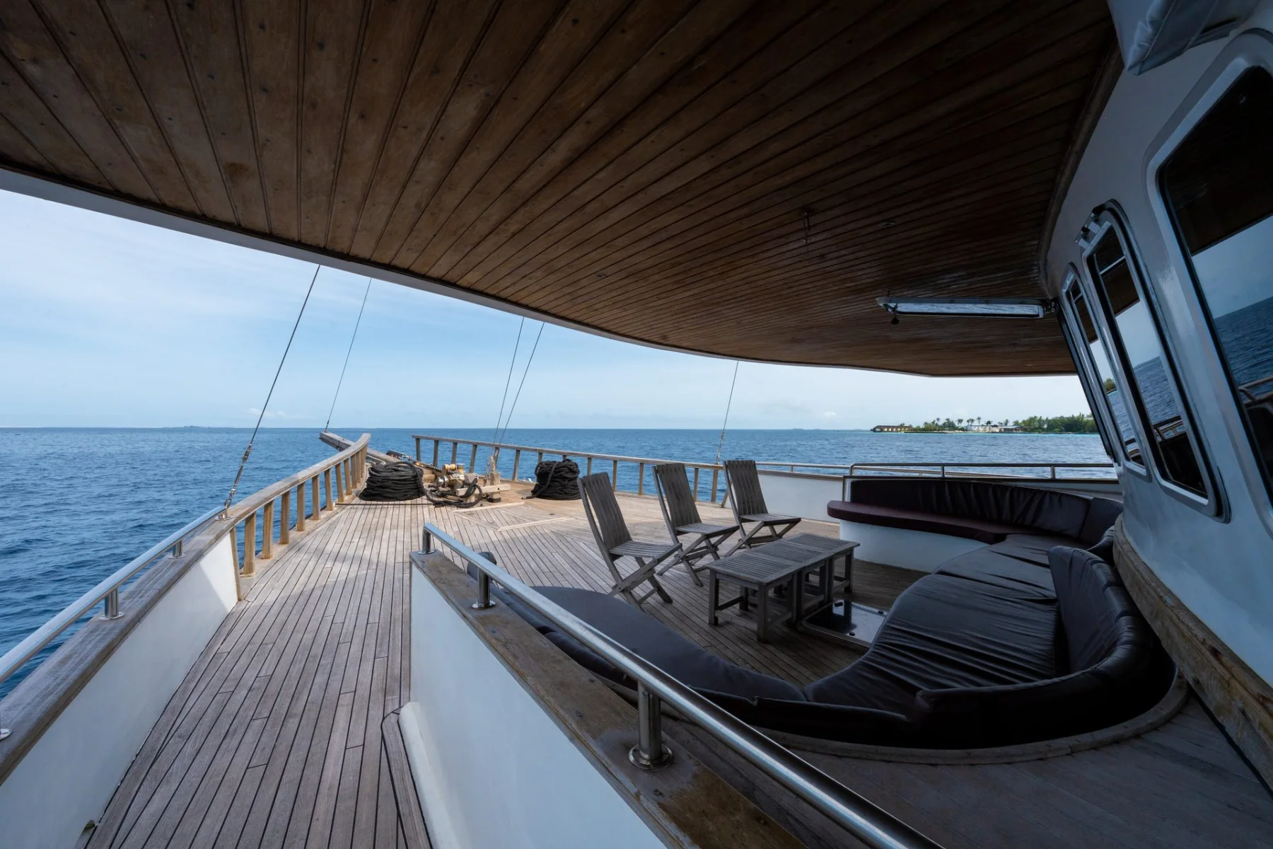 Shaded coffee deck aboard Gurahali for relaxing between island stops