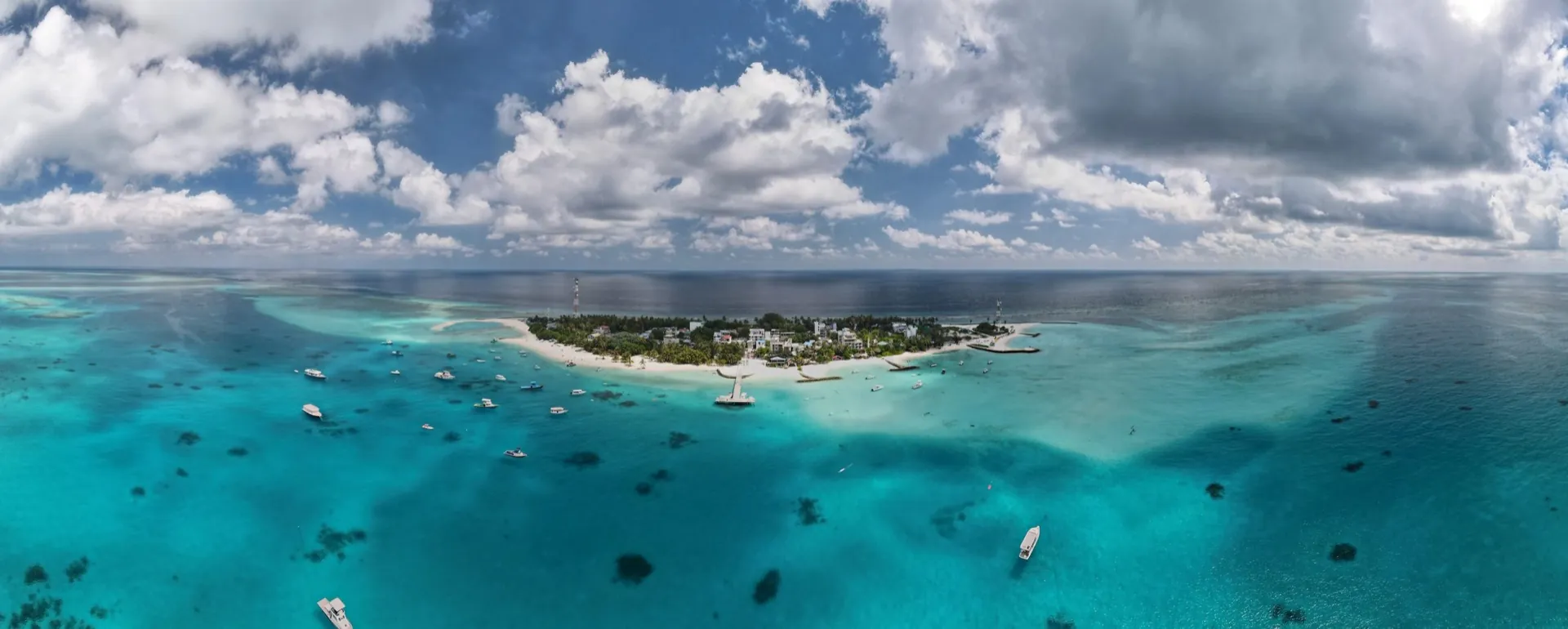 Aerial view of the small island of Fulidhoo surrounded by a turquoise lagoon